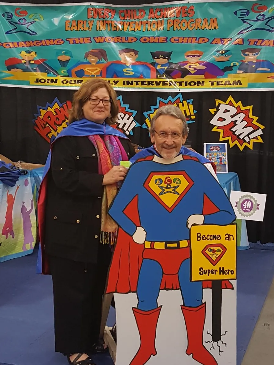 The Every Child Achieves team meeting families at a community event